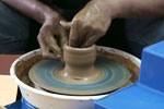 Cylinder pulling on pottery wheel